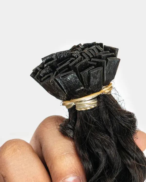 Achieve soft, bouncy curls with Bella Hararo’s Raw Indian Temple Hair Flat-Tip Natural Curly Extensions