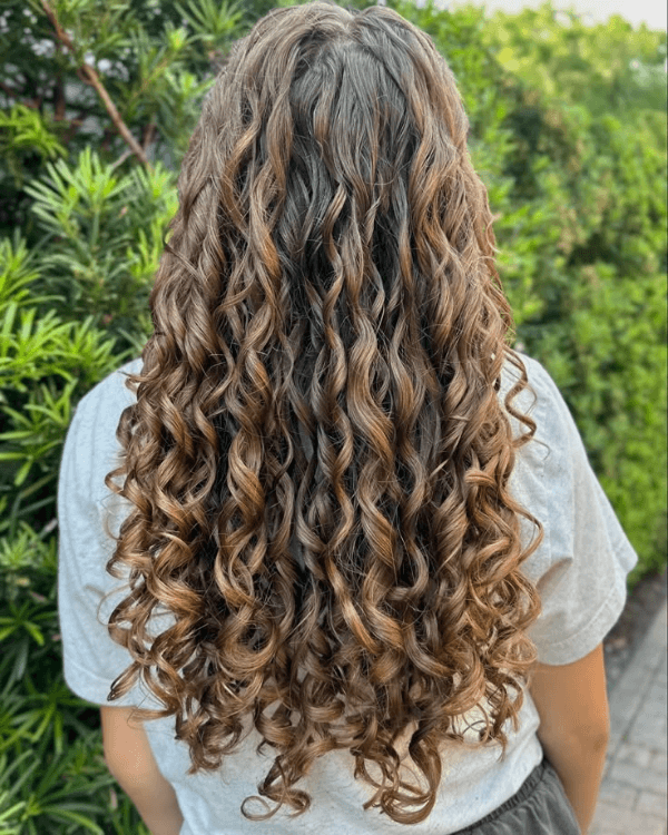 Achieve naturally defined curls with Bella Hararo’s Raw Indian Temple Hair Flat-Tip Indian Curly Extensions