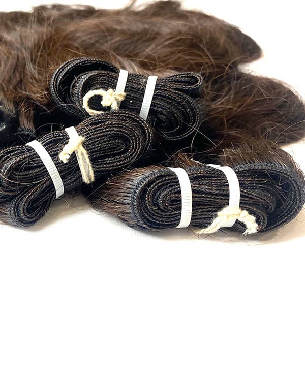 Enhance your beauty with Bella Hararo’s Raw Indian Temple Wefted Wavy Hair, sourced directly from South Indian temples