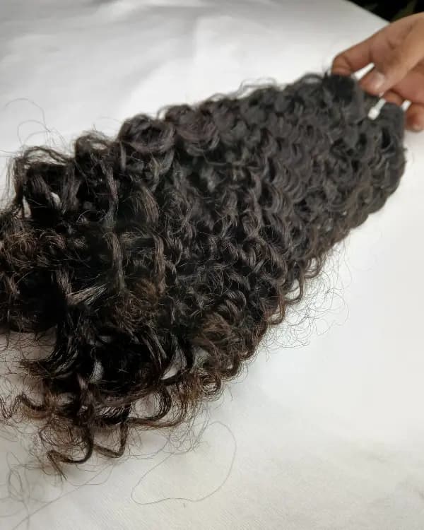 Enhance your look with Bella Hararo’s Indian Remy Indian Curly Weft Hair, crafted from 100% Remy Indian Hair