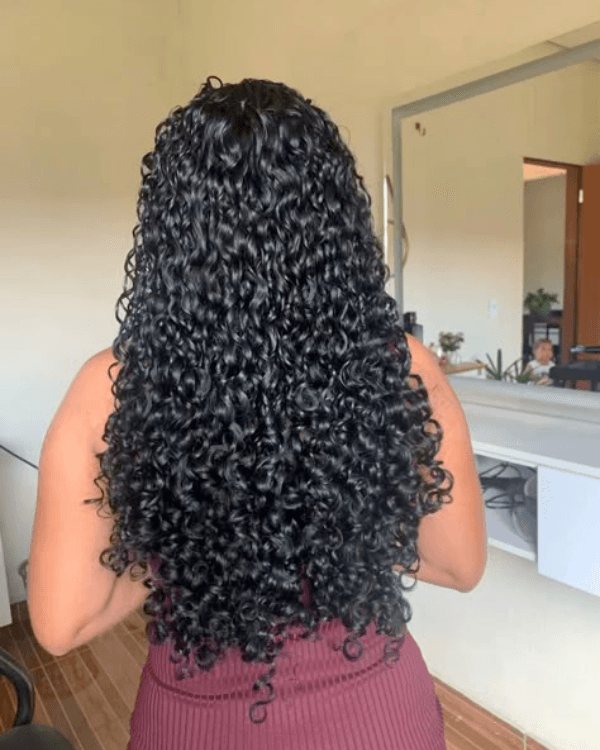 Achieve full-bodied curls and instant volume with Bella Hararo’s 5 PCS Premium Curly Clip-In Extensions